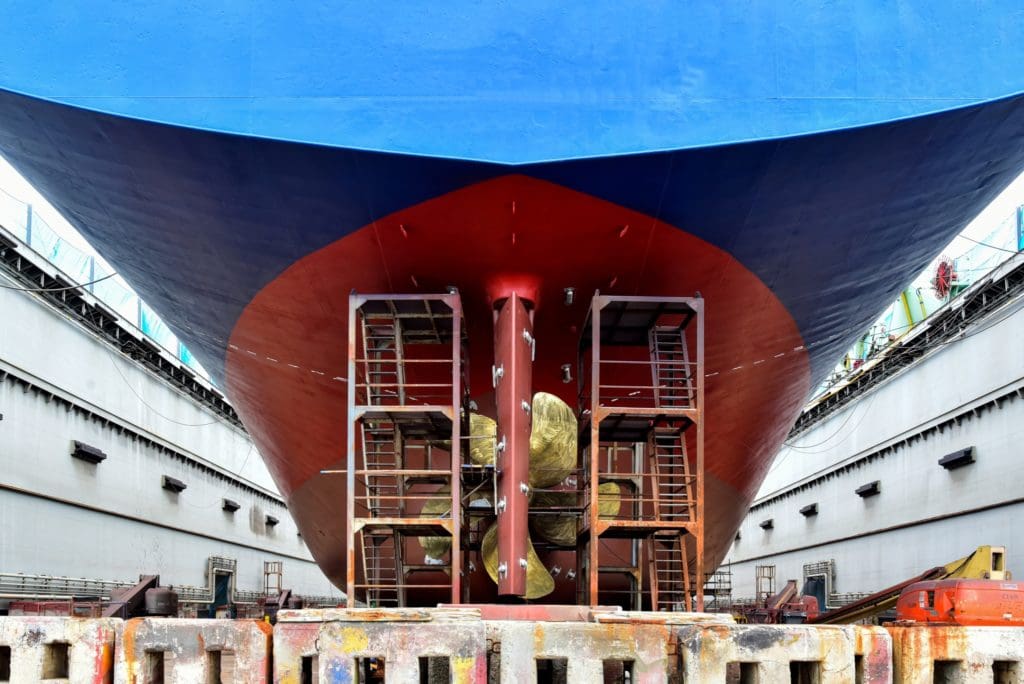 A ship being repaired in a shipyard.