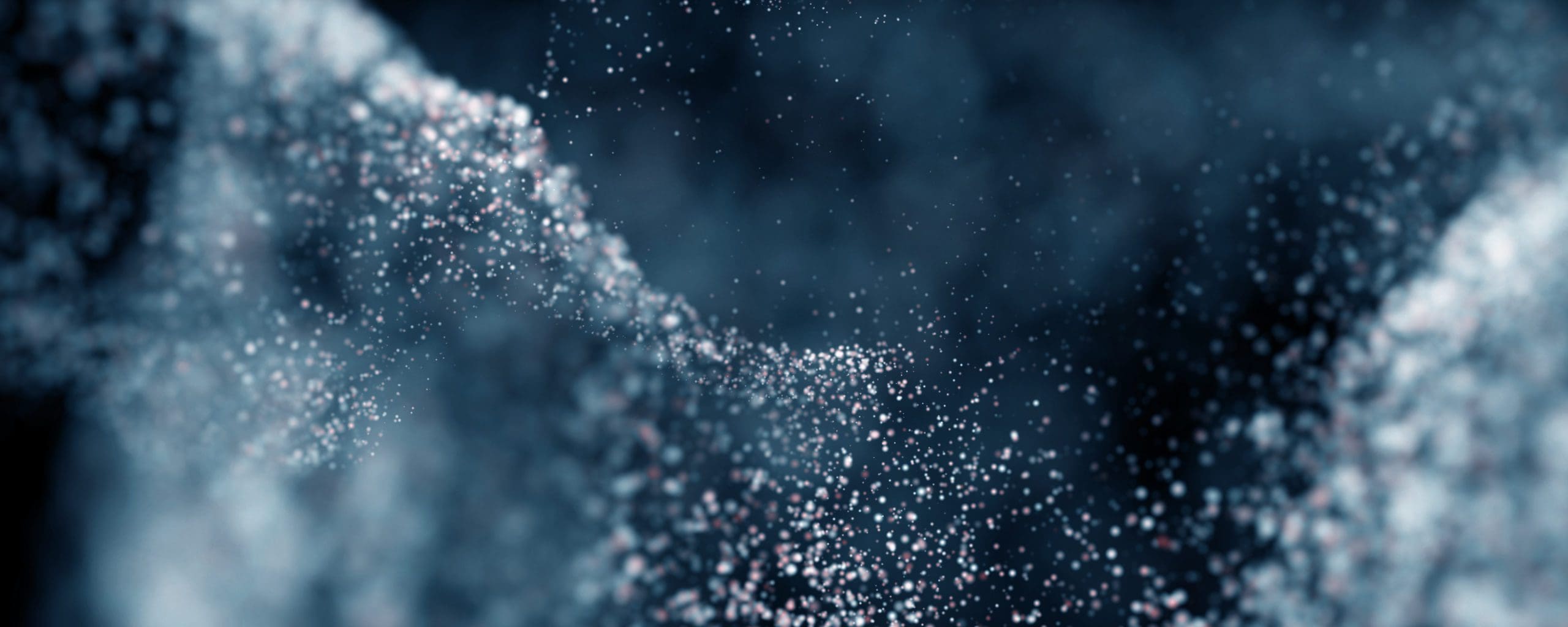 powdered metal flowing across blurred dark background
