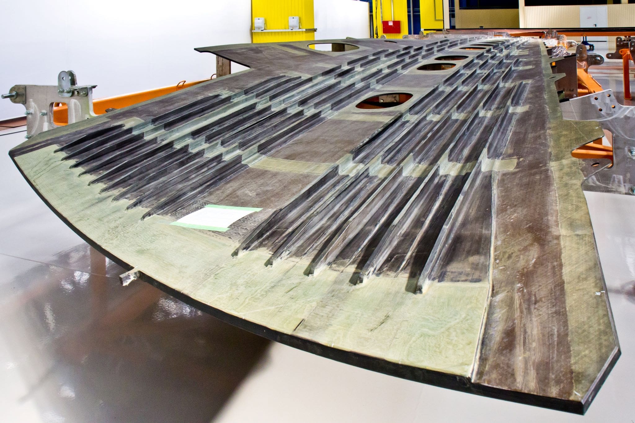 closeup of airplane wing being assembled